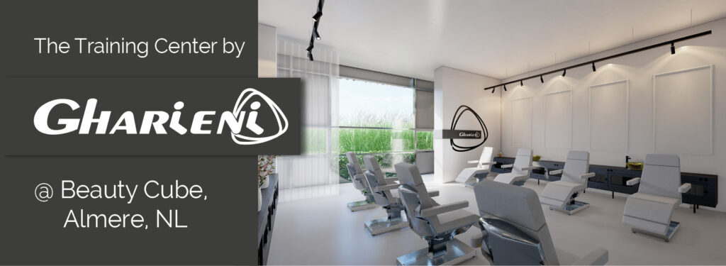 Alt-Text: "Gharieni training center with premium spa treatment tables, Almere, NL."
