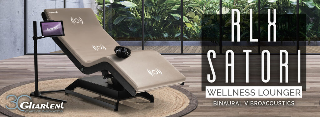 Gharieni RLX Satori wellness lounger with binaural vibroacoustics in a serene spa setting.