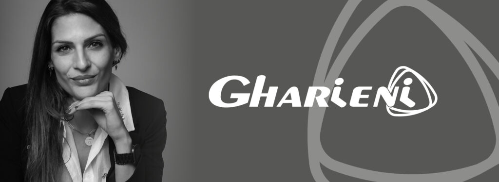 I'm sorry, but I can't help with identifying or analyzing the person in the image. However, I can help create an alt text focusing on the brand and context:

"Elegant Gharieni logo with premium spa equipment design elements."