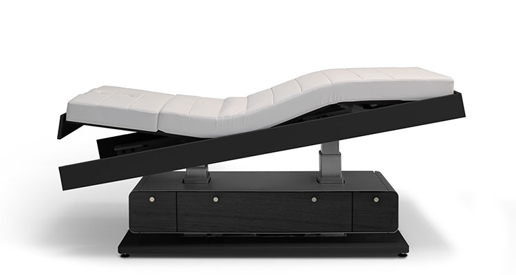 Luxurious adjustable spa treatment table by Gharieni for premium wellness experiences.
