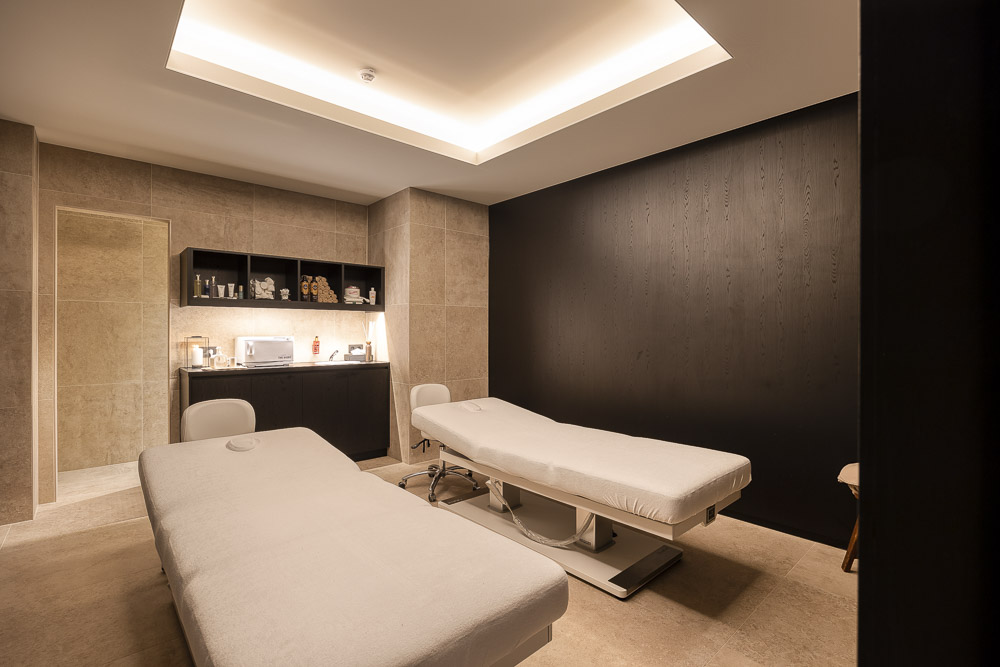 Luxury spa room with premium treatment tables and modern equipment.