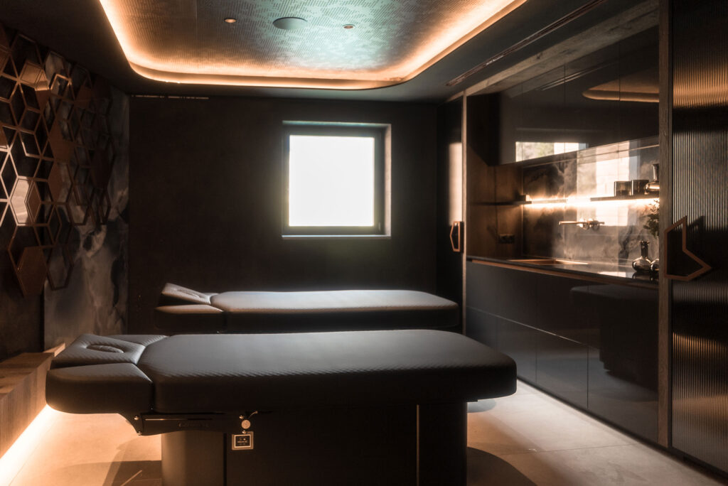 Luxurious Gharieni spa room with premium treatment tables and elegant lighting.