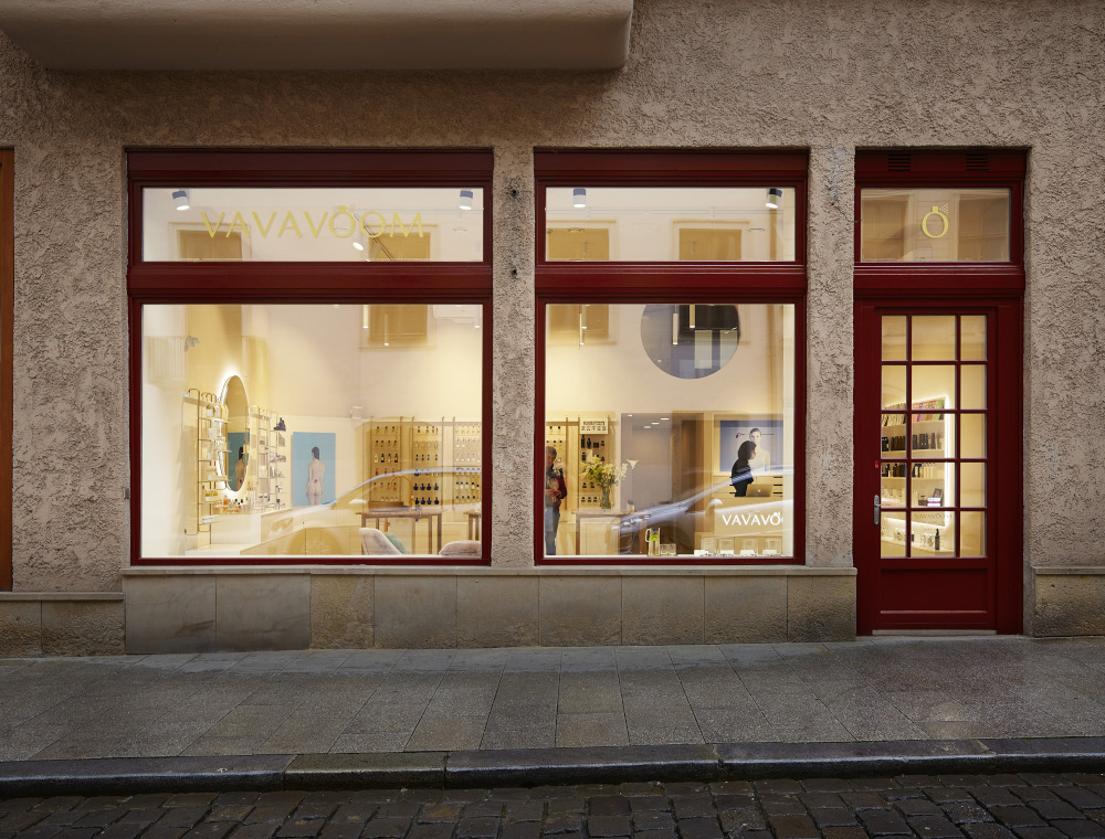 Storefront with elegant spa interiors, showcasing luxury treatment tables and equipment.