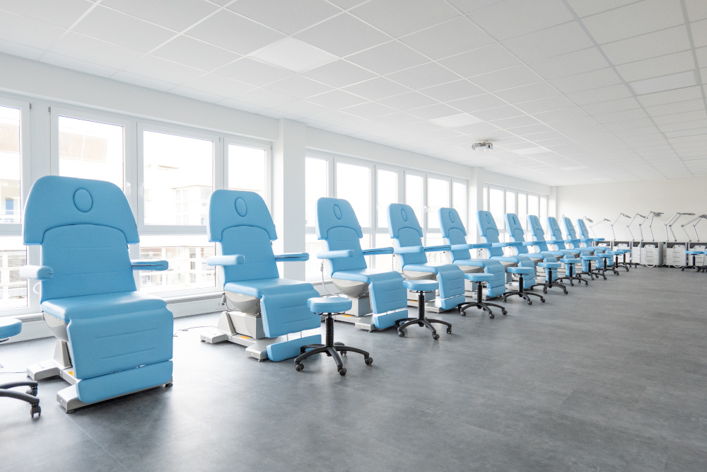 Modern spa treatment chairs in a bright, spacious Gharieni showroom.