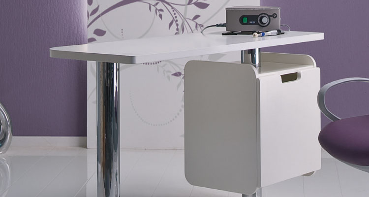Modern spa equipment setup with sleek white treatment table and purple accents.