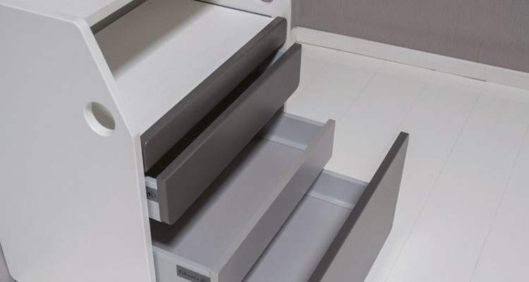 Modern spa treatment cart with open drawers, sleek design by Gharieni.