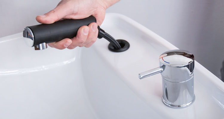 Hand adjusting spa sink faucet, premium equipment from Gharieni.