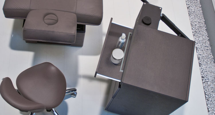 Premium Gharieni treatment table and spa equipment in a modern setting.
