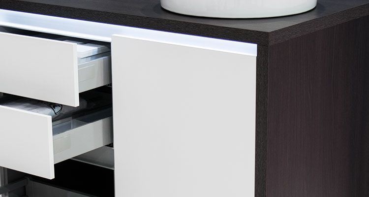 Gharieni spa cabinet with sleek design and open drawers, showcasing premium craftsmanship.