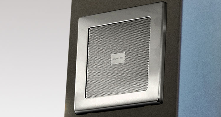 Speaker detail on Gharieni premium treatment table, showcasing sleek design and high-quality materials.