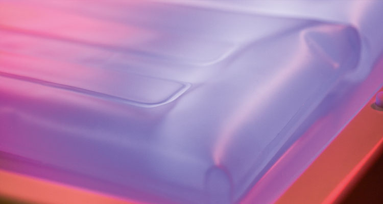 Premium spa treatment table with soft, illuminated cushioning for ultimate relaxation.