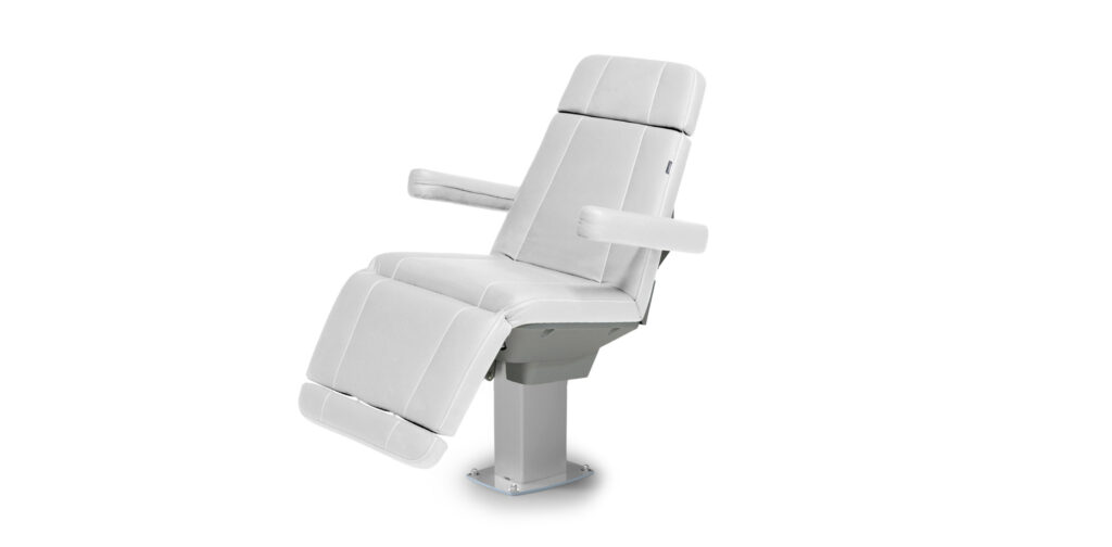 Luxurious white treatment table by Gharieni for premium spa experiences.