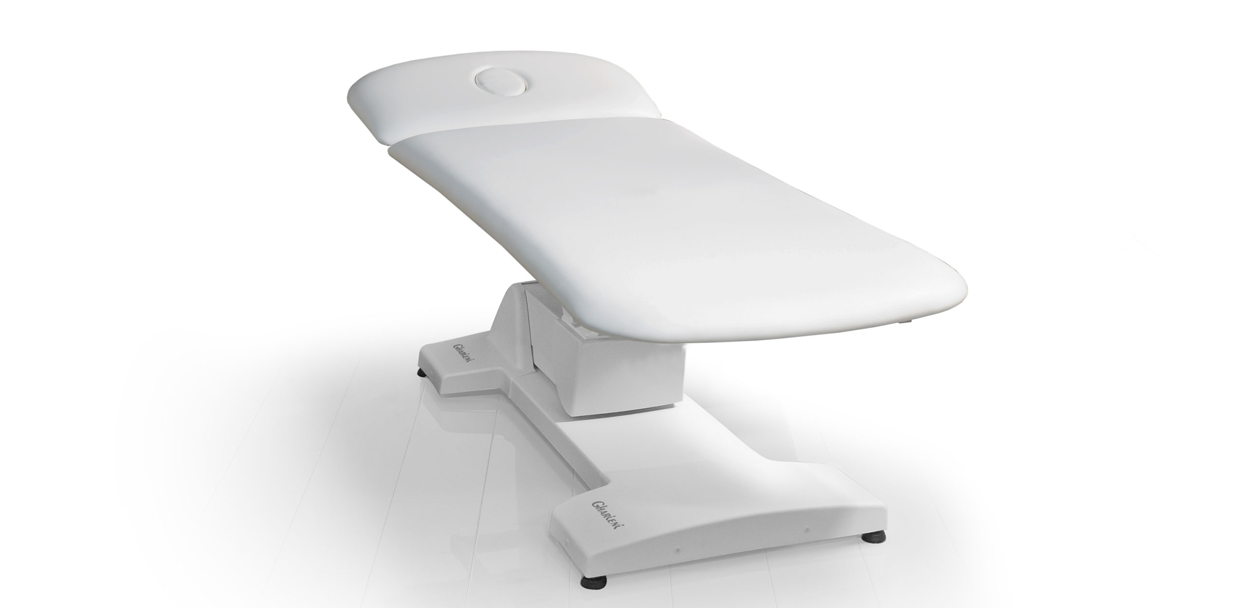 Luxurious white spa treatment table by Gharieni for premium wellness experiences.