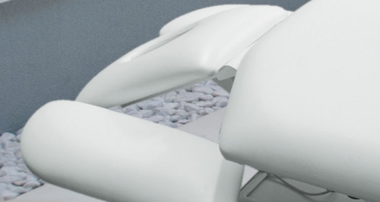 Luxurious Gharieni spa treatment table with ergonomic design for premium comfort.