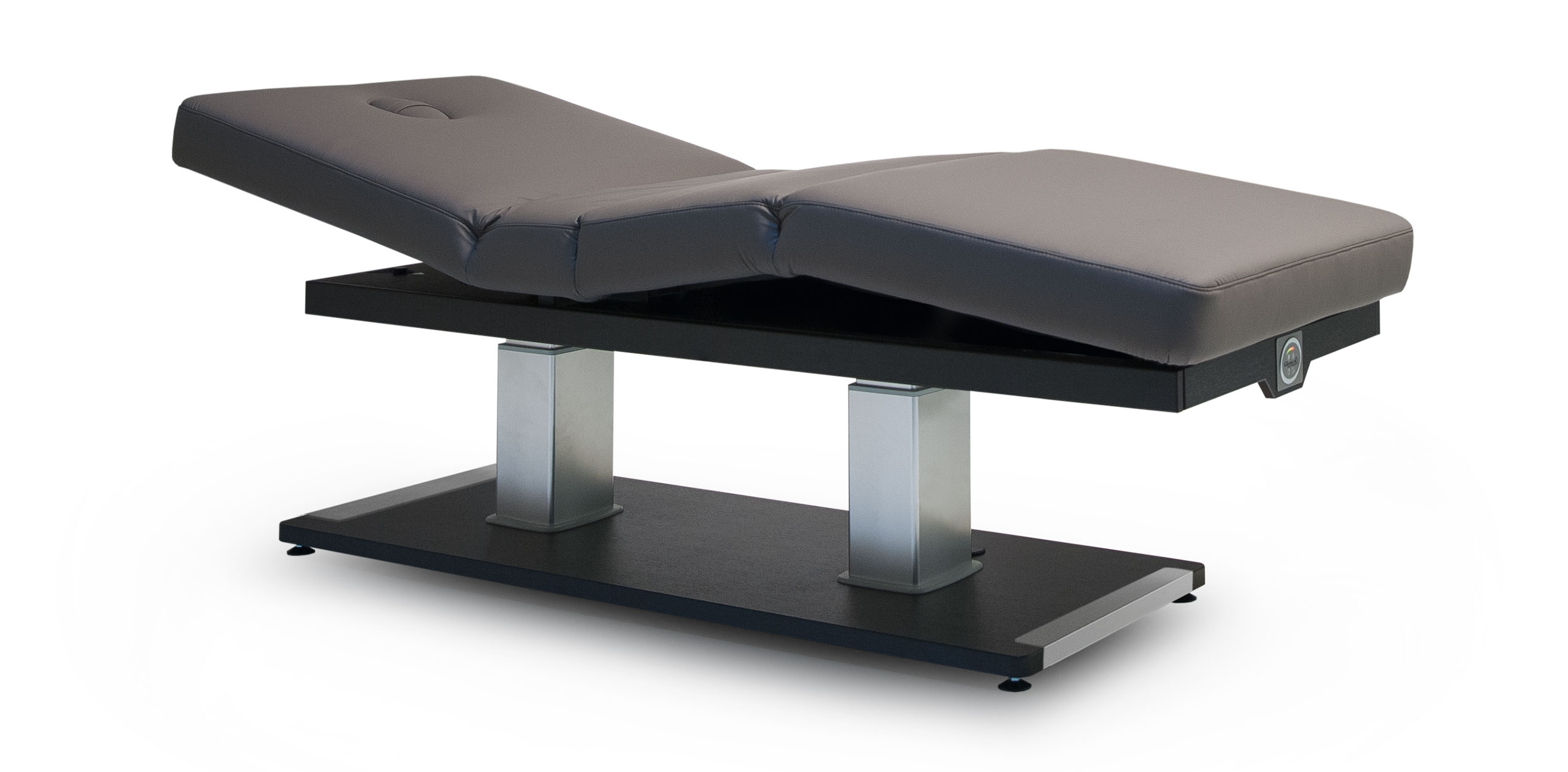 Luxury Gharieni spa treatment table with ergonomic design and sleek finish.