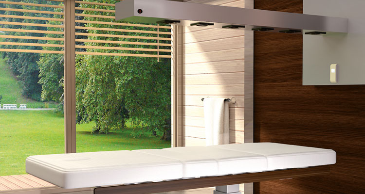 Luxurious spa treatment table by Gharieni with serene forest view.