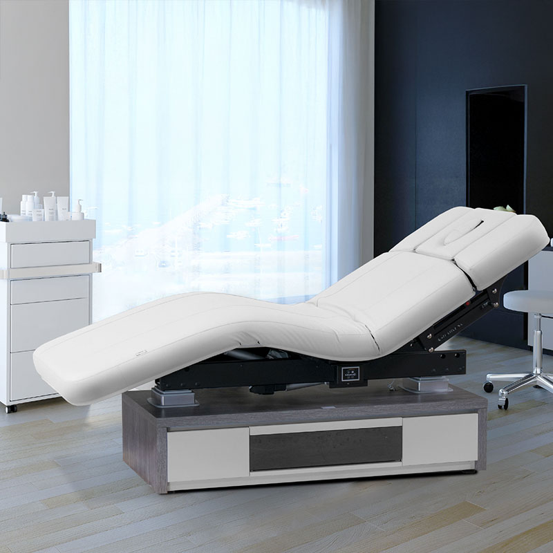 Luxurious Gharieni treatment table in modern spa setting with natural light.