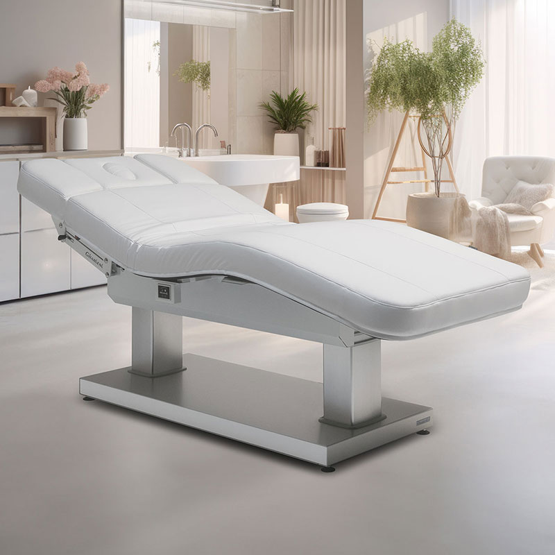 Luxurious Gharieni spa treatment table in elegant, modern wellness setting.