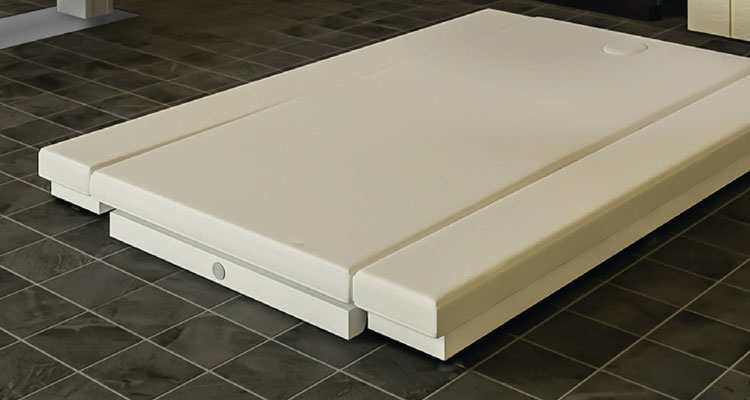 Gharieni premium spa treatment table on elegant tiled floor.
