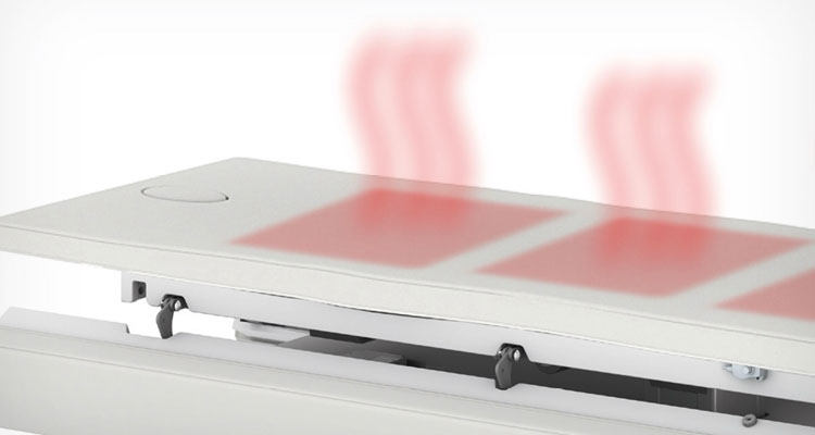 Heated spa treatment table with advanced comfort features by Gharieni.