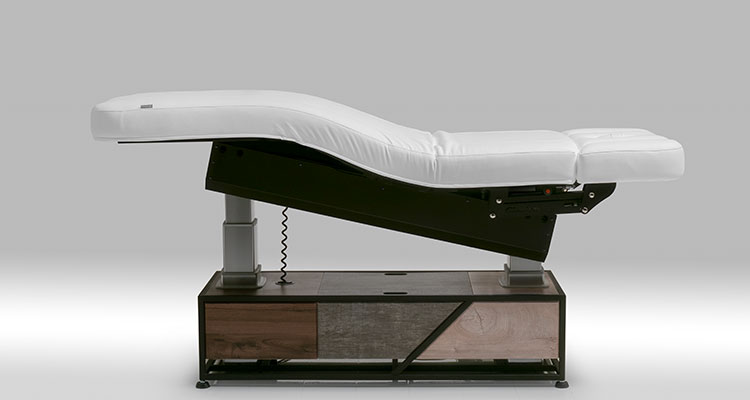 Gharieni premium spa treatment table with ergonomic design and luxurious finish.
