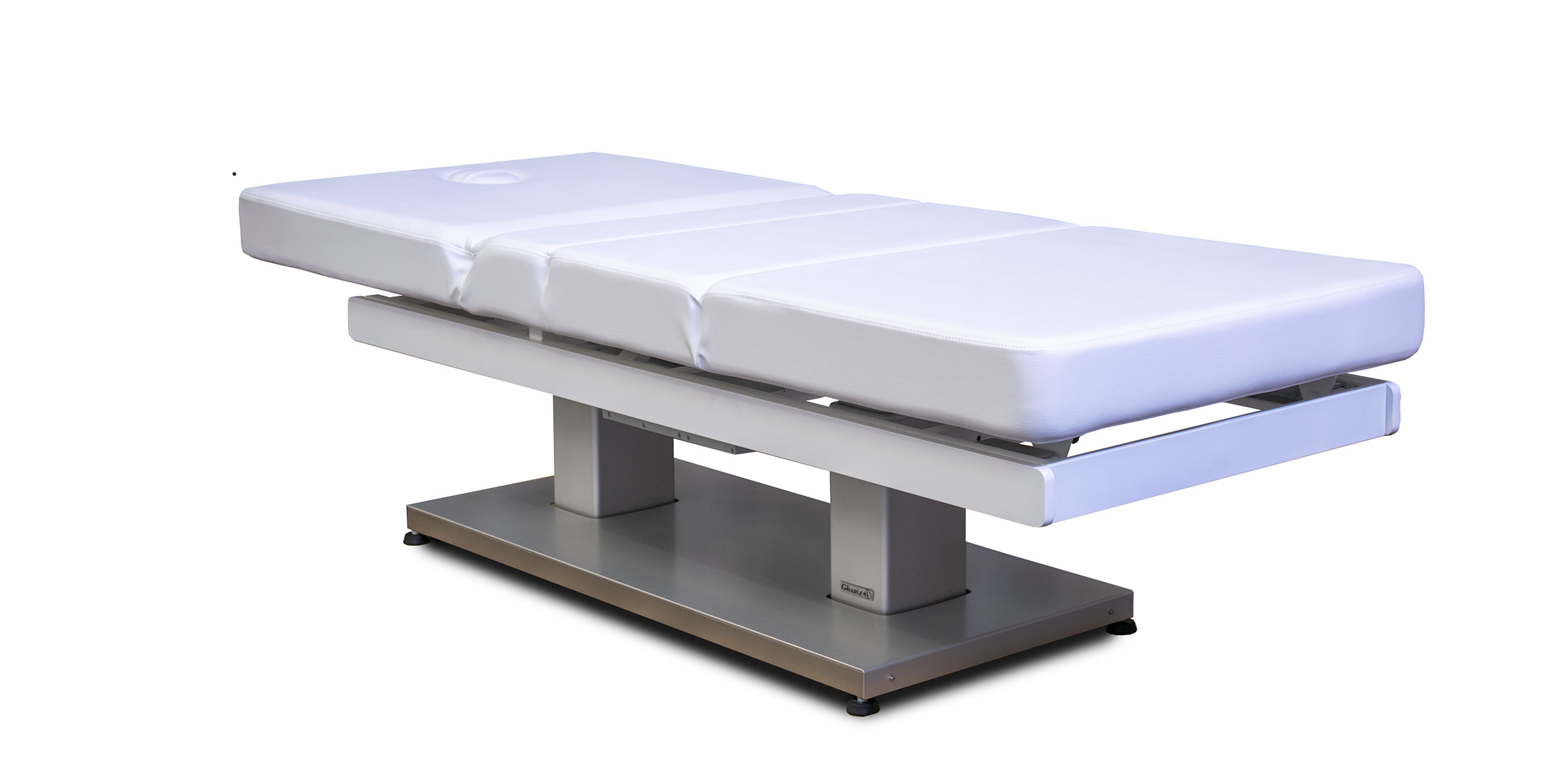 Gharieni luxury treatment table, sleek design, premium spa equipment.