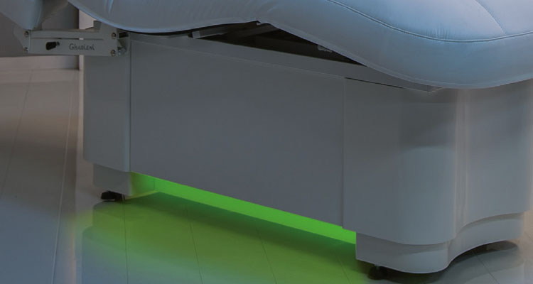 Gharieni luxury spa treatment table with ambient LED lighting.
