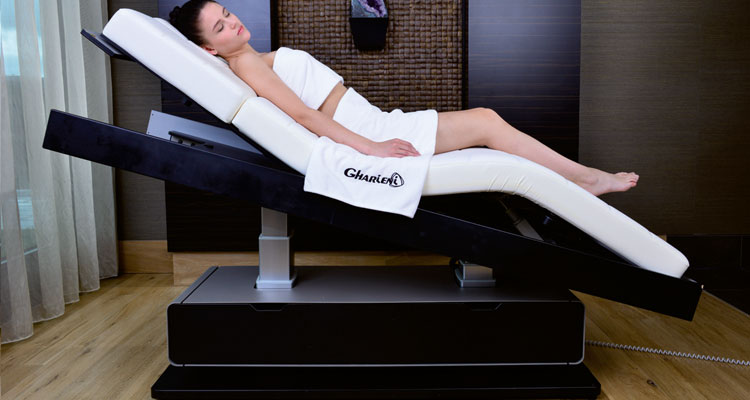 Gharieni luxury spa treatment table with reclining feature and elegant design.