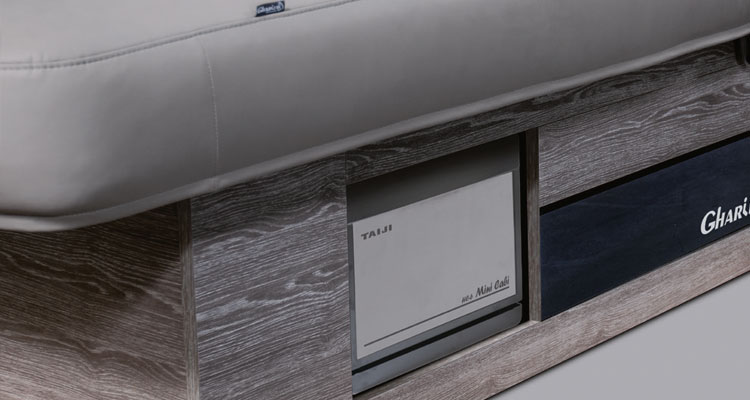 Luxurious Gharieni spa table with sleek wood finish and premium upholstery.