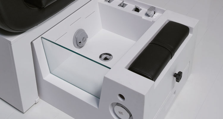 Modern spa treatment table with sleek design and integrated features.