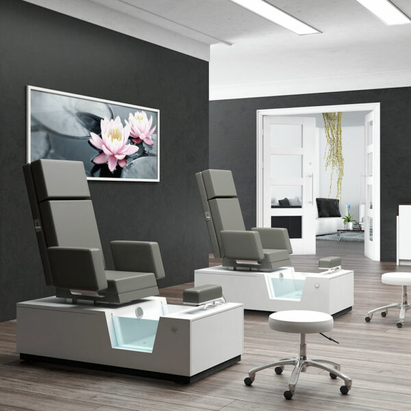 Luxurious spa treatment room with Gharieni pedicure chairs and modern decor.