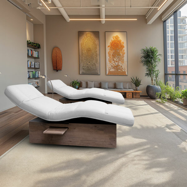 Luxurious spa room with Gharieni treatment tables, modern decor, and natural light.