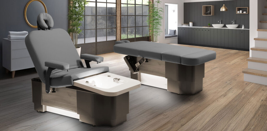 Luxurious Gharieni spa tables in modern, elegant treatment room setting.
