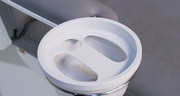 Gharieni luxury spa treatment table with ergonomic design and sleek contours.
