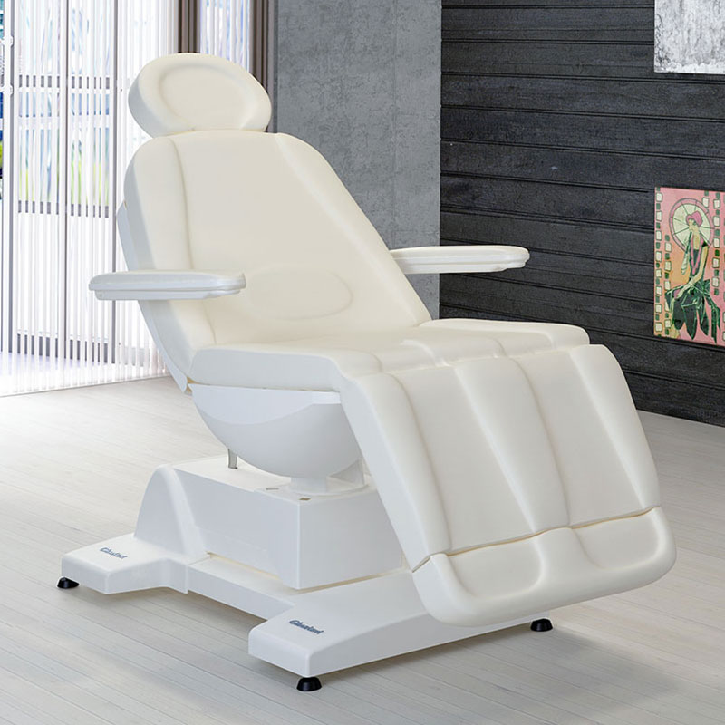 Luxurious Gharieni spa treatment table in modern, serene setting.