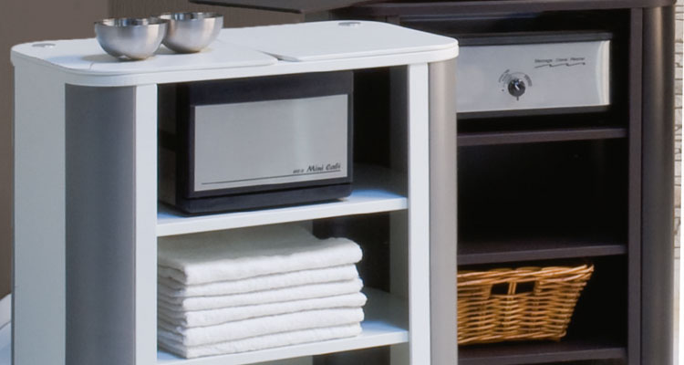 Premium spa equipment with towels, bowls, and storage shelves for luxury treatments.