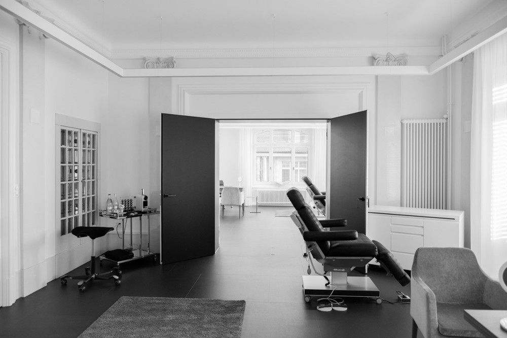 Luxurious spa room with premium Gharieni treatment tables and sleek equipment.