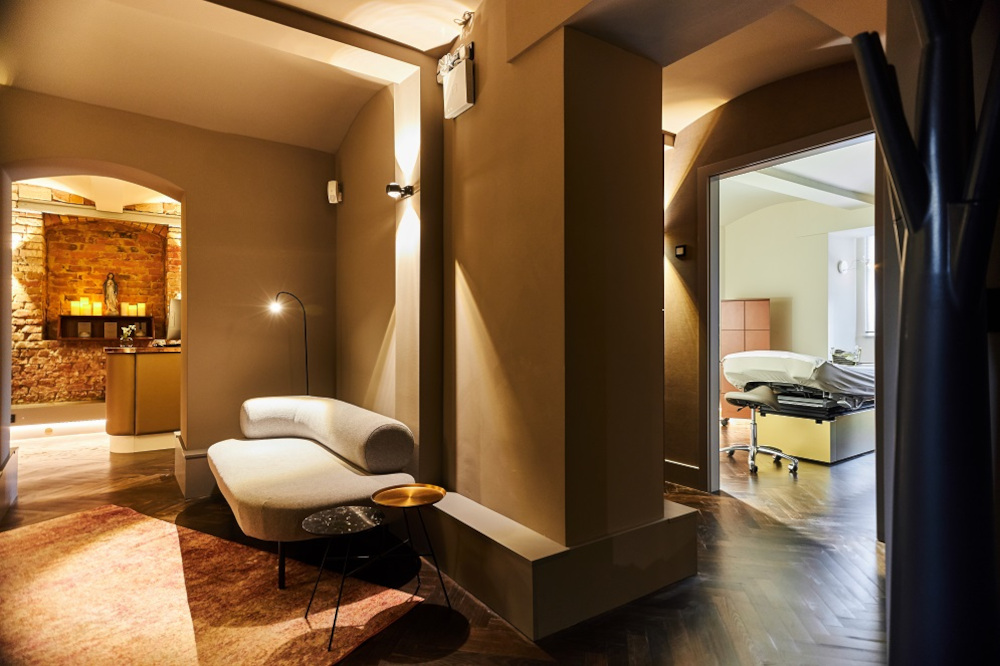 Sophisticated spa interior with luxury treatment table and modern furnishings.