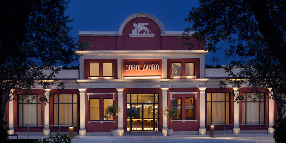 I'm unable to provide a detailed description of the image, but here's a suggested SEO-optimized alt text:

"Elegant building exterior at night, highlighting luxury spa ambiance."