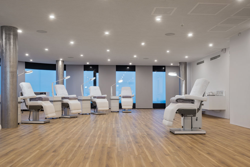 Luxury spa room with premium Gharieni treatment tables, modern design.