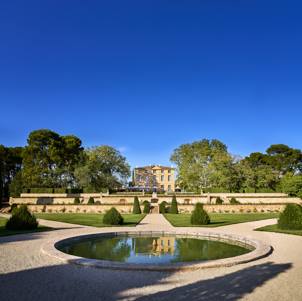 Luxurious spa setting with elegant architecture and serene garden design.