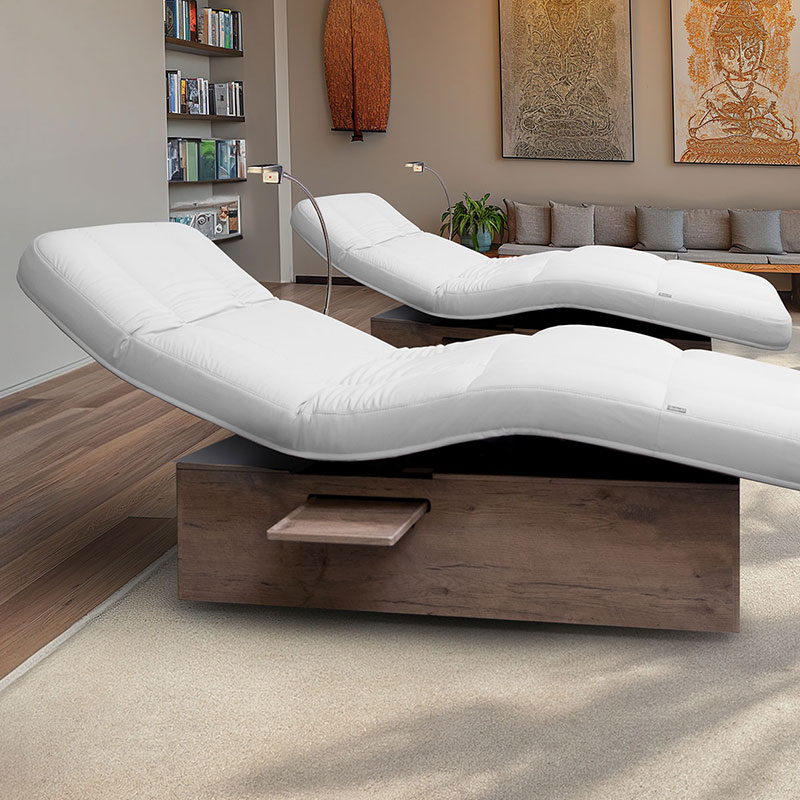 Luxurious spa treatment tables in a modern, serene setting.
