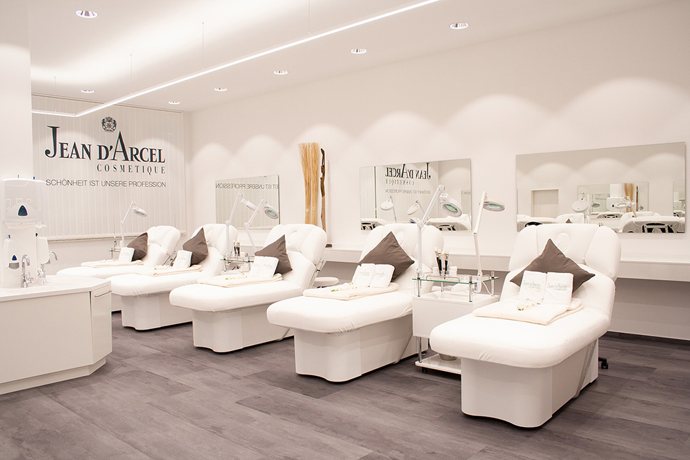 Luxurious spa room with premium Gharieni treatment tables and elegant decor.