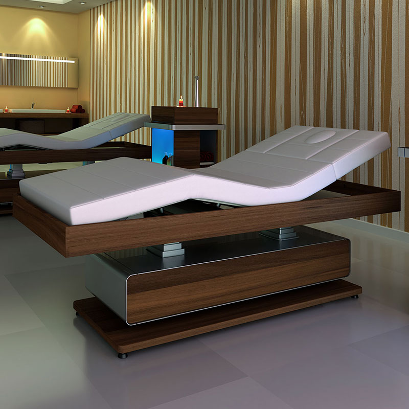 Luxurious spa treatment table in elegant wood and white leather design.