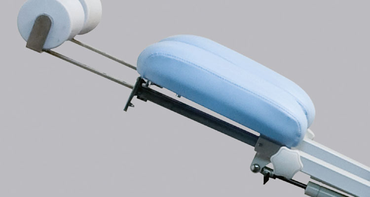 Gharieni premium spa treatment table with ergonomic blue cushioning.