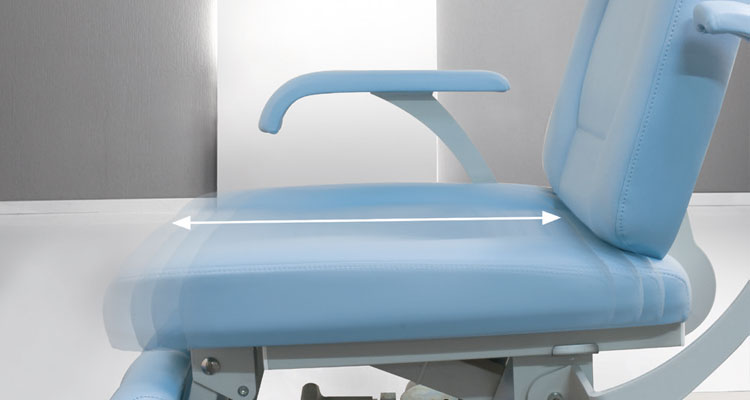 Luxurious adjustable spa treatment table in elegant blue upholstery.