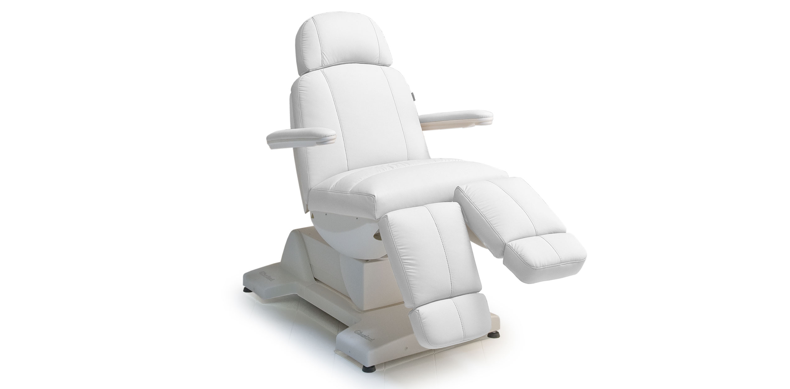 Luxurious white spa treatment table by Gharieni for premium wellness.