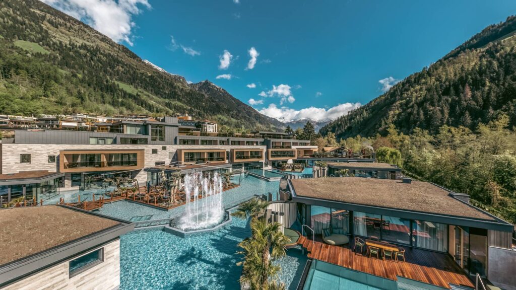 Luxurious mountain spa resort with premium treatment tables and stunning views.