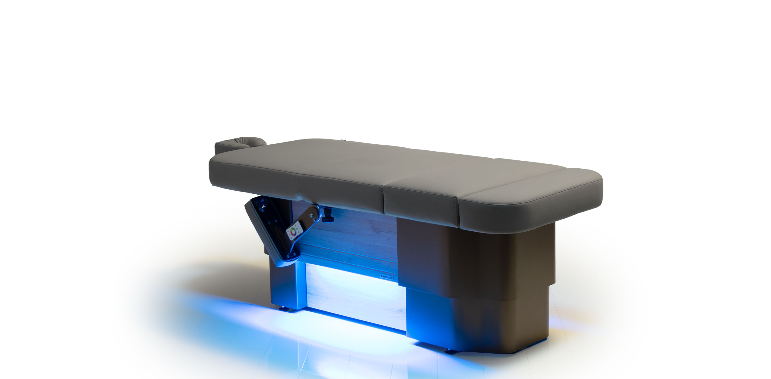 Luxurious Gharieni spa treatment table with sleek design and LED lighting.