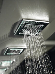 Luxurious rainfall showerhead with sleek design, enhancing spa experience.